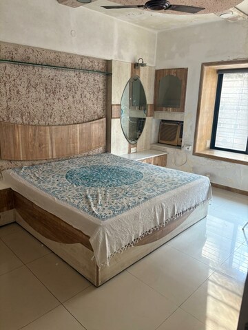 Bedroom in 2 BHK Apartment at NRI Complex Phase I, Seawoods Sector 58 – for Rent