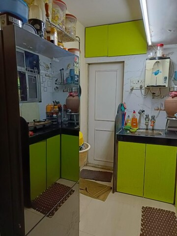 Kitchen in 1 BHK Apartment at Puranik Hometown, Ghodbunder Road – for Rent