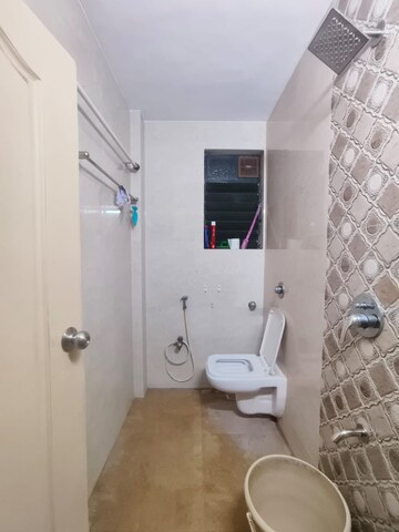 Bathroom in 1 BHK Apartment at Raghu Vihar Apartments, Dahisar West – for Rent