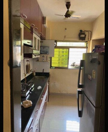 Kitchen in 2 BHK Apartment at Rosa Gardenia, Ghodbunder Road – for Rent
