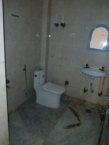 Bathroom in 2 BHK Apartment at Aims Golf City, Sector 75 – for Rent