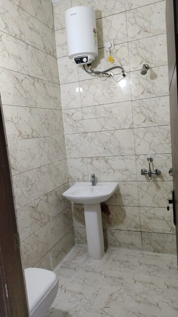 Bathroom in 3 BHK Apartment at Dhakoli Village – for Rent