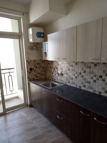 Kitchen in 2 BHK Apartment at Ansals Celebrity Greens, Sushant Golf City – for Rent