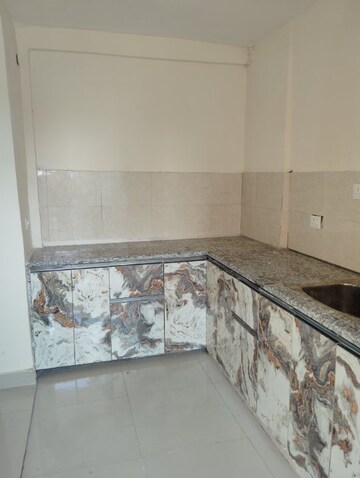 Kitchen in 3 BHK Apartment at Kbnows Apartment, Sector 16 Greater Noida – for Rent