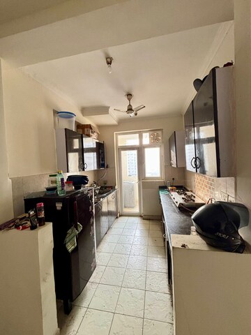 Kitchen in 2 BHK Apartment at Aims Golf City, Sector 75 – for Rent