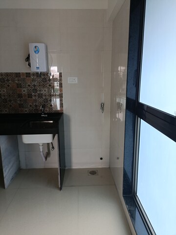 Kitchen in 3 BHK Apartment at Rajesh Raj Infinia, Malad West – for Rent