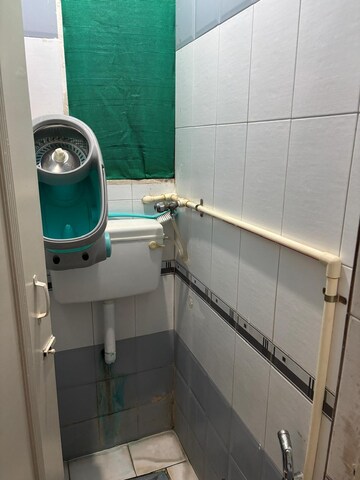 Bathroom in 1 BHK Apartment at Brahmand CHS, Brahmand – for Sale