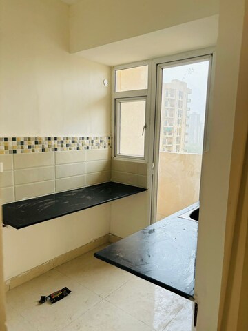 Kitchen in 2 BHK Apartment at Signature Global Orchard Avenue, Sector 93 – for Rent