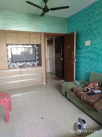 Living Room in 2 BHK Apartment at Vijay Enclave, Waghbil – for Rent
