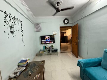 Living Room in 1 BHK Apartment at Seawoods West – for Sale