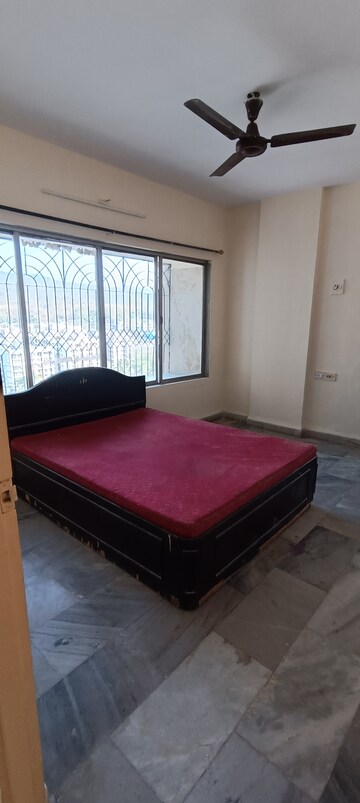 Bedroom in 2 BHK Apartment at Crimson Tower, Kandivali East – for Rent