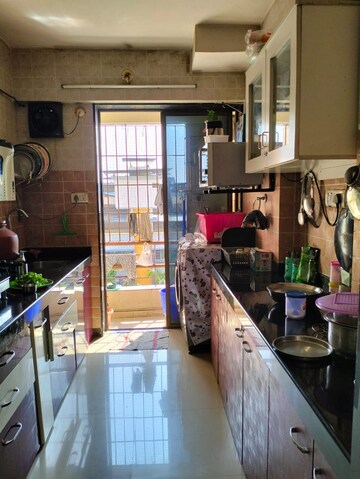 Kitchen in 2 BHK Apartment at Jaydeep Park, Majiwada – for Sale