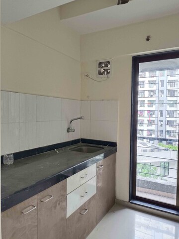 Kitchen in 1 BHK Apartment at Rustomjee Global City – for Sale