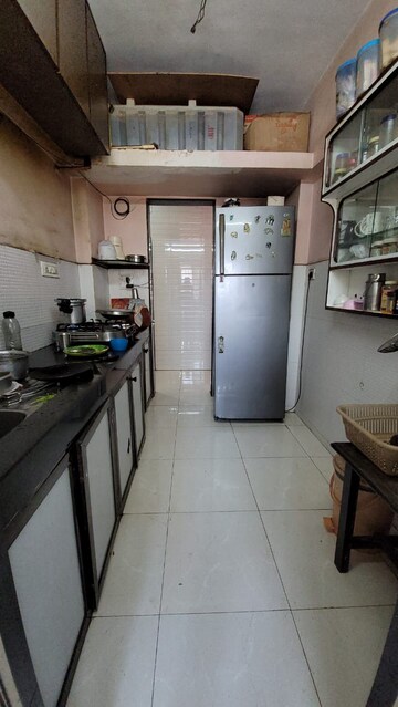 Kitchen in 2 BHK Apartment at Evershine Pine CHS, Mira Road – for Sale