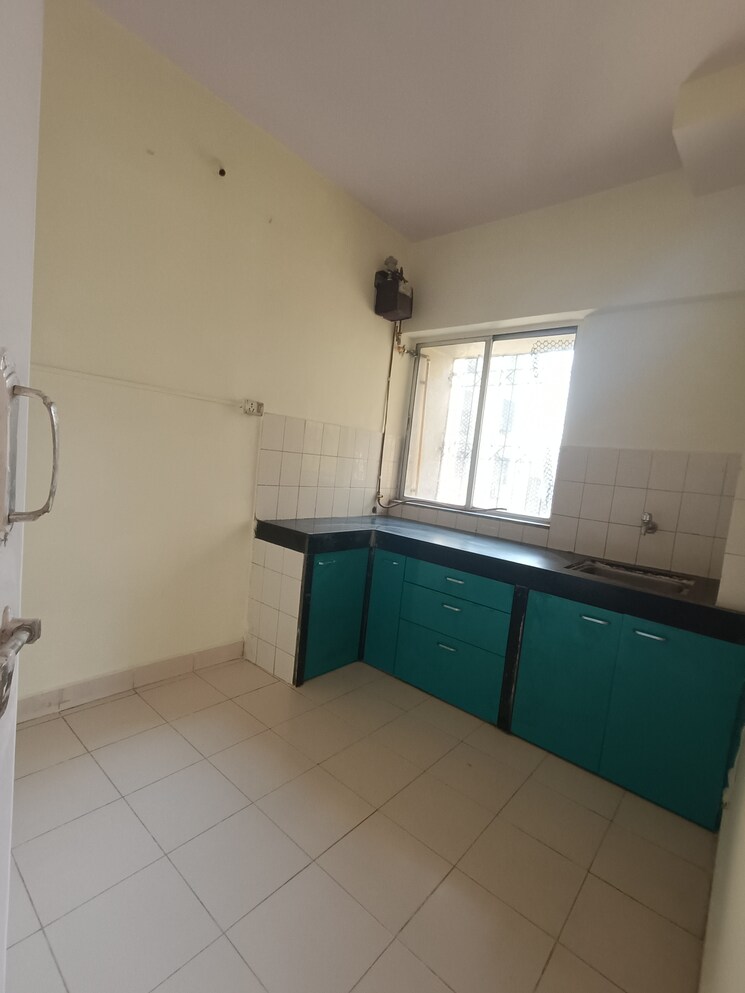 Kitchen, eden-rose-apartment 2 Bedroom 800 Sq.Ft. Apartment In Mira Road Thane 8240311
