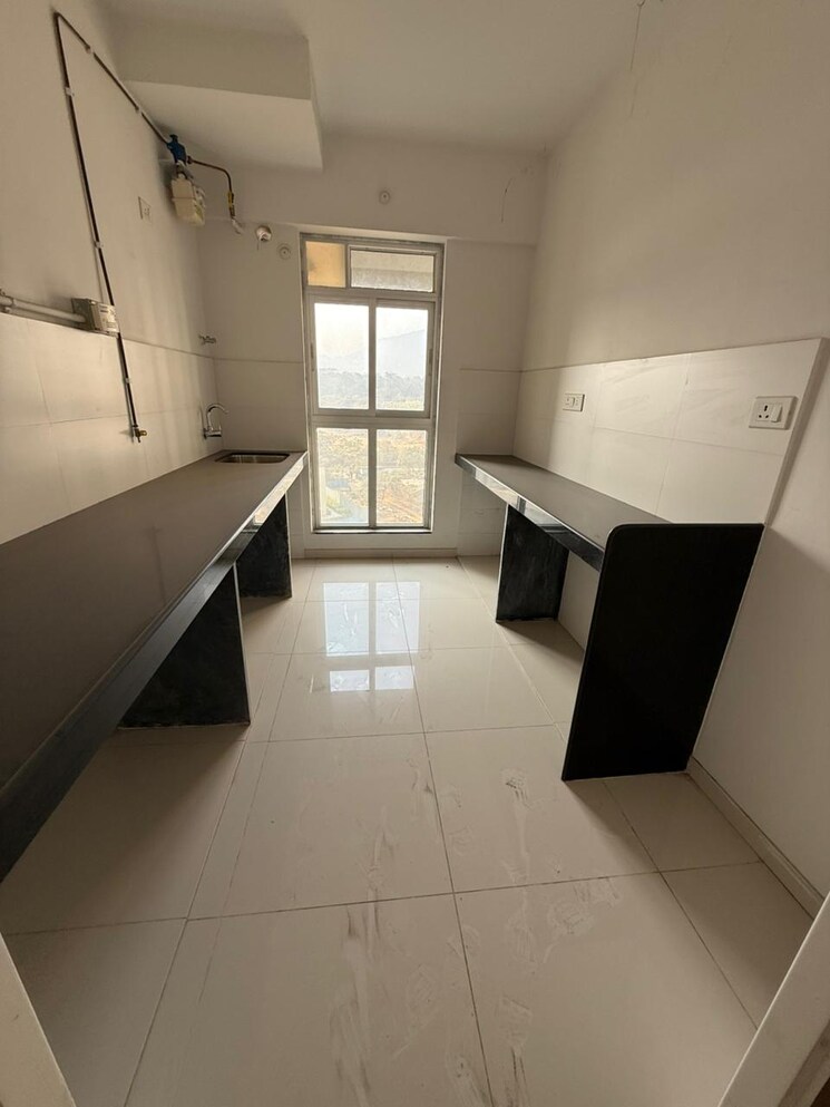 Kitchen, godrej-emerald 2 Bedroom 708 Sq.Ft. Apartment In Ghodbunder Road Thane 8240417