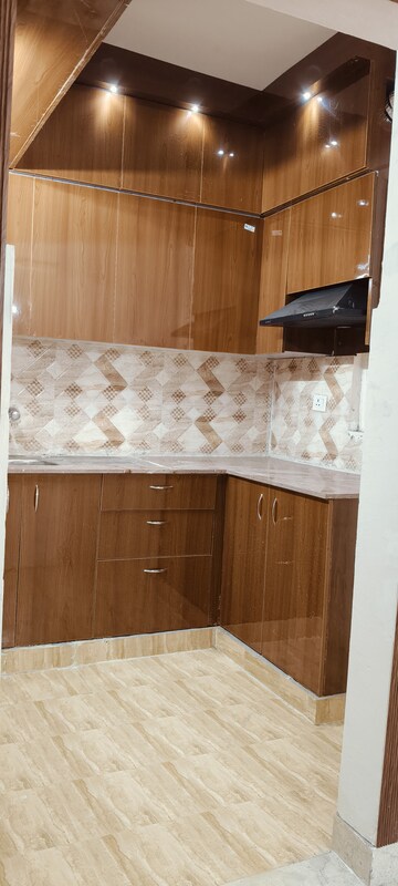 Kitchen in 2 BHK Apartment at Amrapali Golf Homes, Sector 4, Greater Noida – for Sale