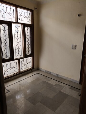 Room in 2 BHK Apartment at Dhakoli Village – for Rent
