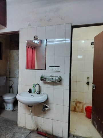 Bathroom in 1 BHK Apartment at Jasola Vihar – for Sale