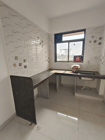 Kitchen in 2 BHK Apartment at Murbad Road – for Sale