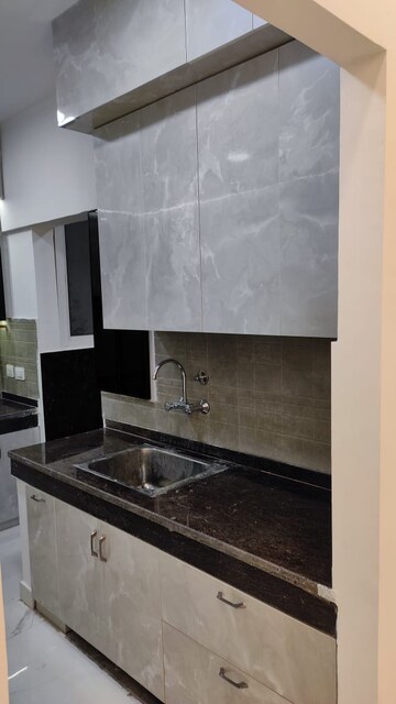 Kitchen in 3 BHK Apartment at Amrapali Golf Homes, Sector 4, Greater Noida – for Rent