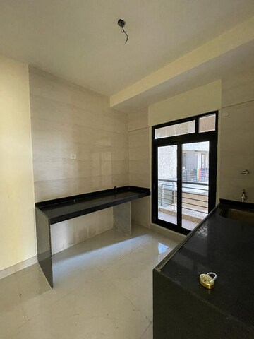 Kitchen in 1.5 BHK Apartment at MJ Shah Centrio, Govandi – for Rent