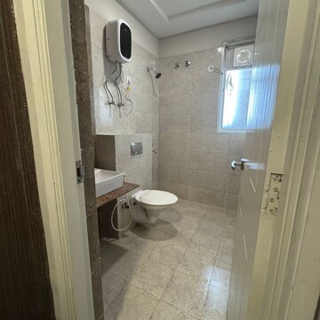 Bathroom in 3 BHK Apartment at Mahagun Mirabella, Sector 79 – for Rent