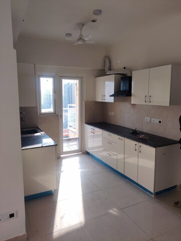 Kitchen in 3 BHK Apartment at Samridhi Luxuriya Avenue, Sector 150 – for Rent