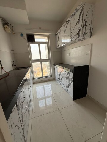 Kitchen in 1.5 BHK Apartment at Godrej Emerald, Ghodbunder Road – for Sale
