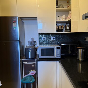 Kitchen in 3 BHK Apartment at Sheth Vasant Lawns, Oswal Park – for Rent
