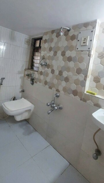 Bathroom in 1 BHK Apartment at Sonal Link Residency, Malad West – for Rent