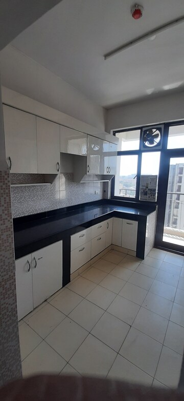 Kitchen in 4 BHK Apartment at AWHO Twin Towers PH4, Omega I Greater Noida – for Rent