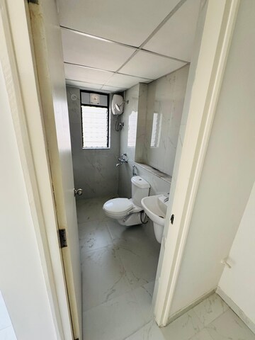 Bathroom in 1 BHK Apartment at Runwal Gardens, Dombivli East – for Rent