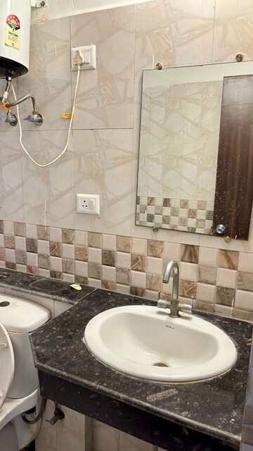 Bathroom in 3.5 BHK Apartment at Aims Golf City, Sector 75 – for Rent