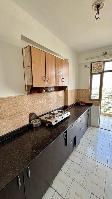Kitchen in 3.5 BHK Apartment at Aims Golf City, Sector 75 – for Rent