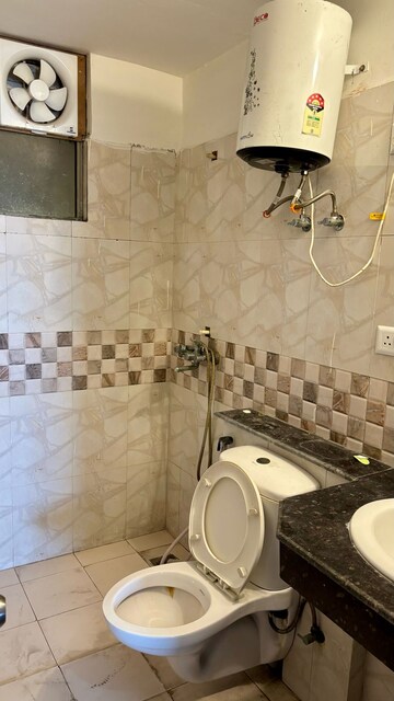 Bathroom in 3.5 BHK Apartment at Aims Golf City, Sector 75 – for Rent