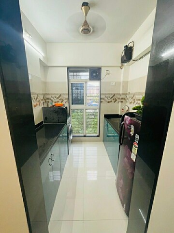Kitchen in 1 BHK Apartment at Metro Giriraj Apartment, Mulund West – for Sale