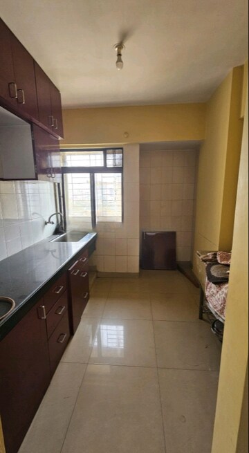 Kitchen in 2 BHK Apartment at Ram Pushpanjali Residency, Owale – for Sale
