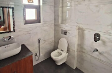 Bathroom in 4 BHK Builder Floor at Sector 24 – for Rent