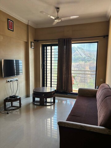 Living Room in 1 BHK Apartment at K Raheja Heights, Malad East – for Rent
