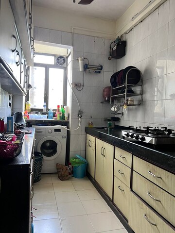 Kitchen in 2 BHK Apartment at Malad Amber CHS, Malad West – for Rent