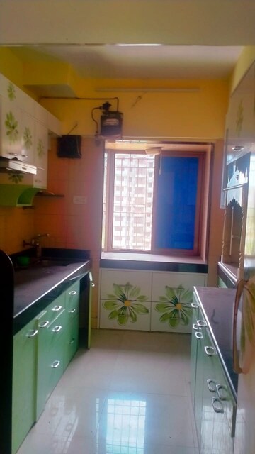 Kitchen in 2 BHK Apartment at Harmony Residency Owale, Owale – for Rent