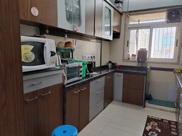 Kitchen in 2.5 BHK Apartment at Pride Presidency Luxuria, Ghodbunder Road – for Sale