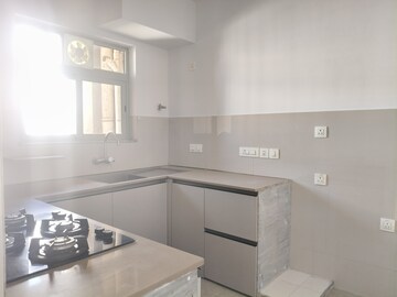 Kitchen in 2 BHK Apartment at Hiranandani Estate Rodas Enclave, Ghodbunder Road – for Rent