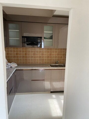 Kitchen in 3 BHK Apartment at Mahagun Mywoods, Sector 16c Greater Noida – for Rent