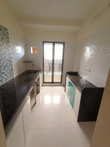 Kitchen in 2 BHK Apartment at Man Opus, Mira Road – for Sale