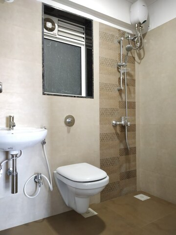Bathroom in 2 BHK Apartment at Unique Poonam Estate Cluster 2, Mira Road – for Sale