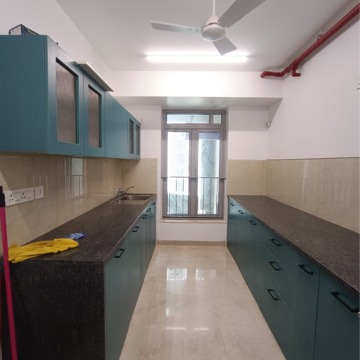 Kitchen in 3 BHK Apartment at Oberoi Sky City, Khande Rao Dongari – for Rent