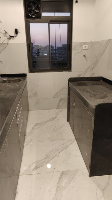 Kitchen in 2 BHK Apartment at Dev Leo Tower, Oshiwara – for Rent