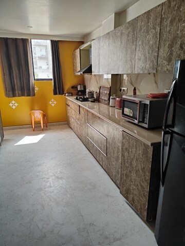 Kitchen in 4 BHK Apartment at Ansal API Esencia, Sector 67 – for Rent